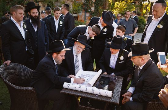 Jewish men signing the ketubah at Shepstone Gardens Wedding Venue