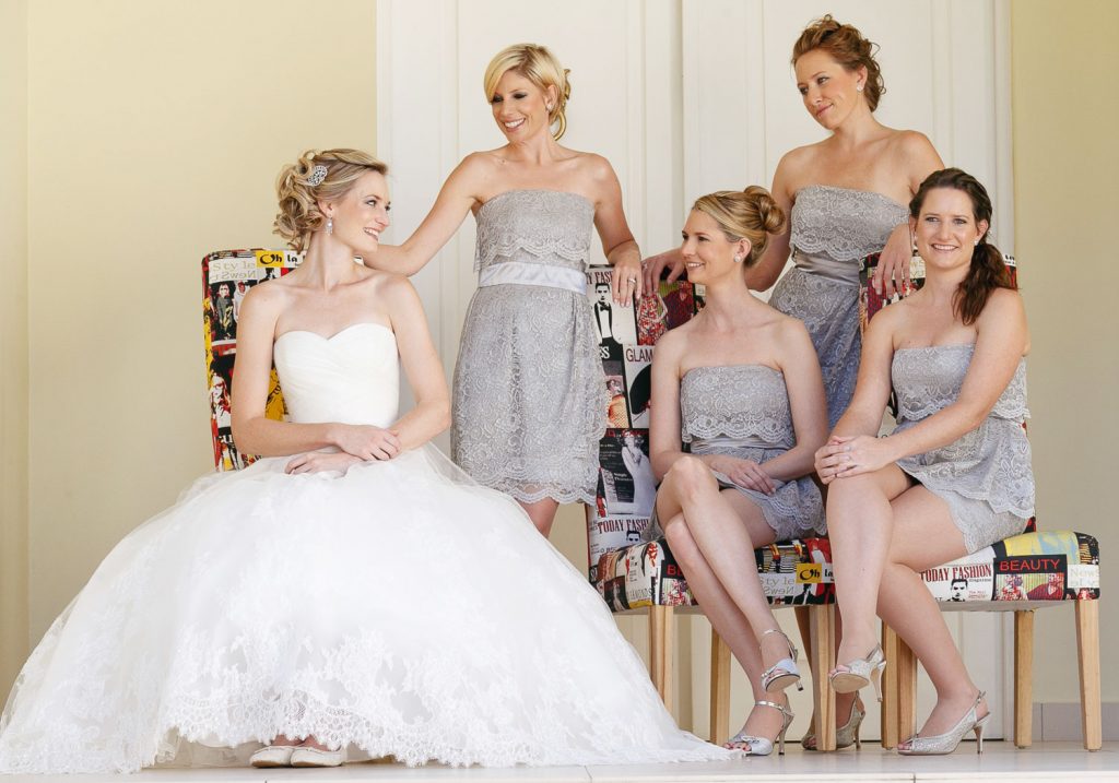 bridesmaids in grey dresses sitting on chairs at the Fourseasons The Westcliff Hotel