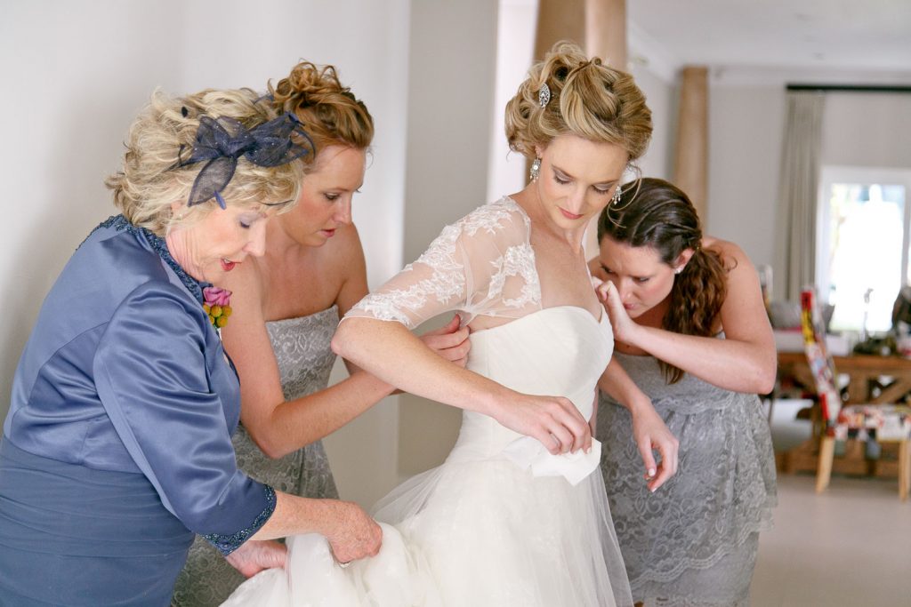 English Bride and bridesmaids getting dressed at The Fourseasons Hotel The Westcliff in Parktown Johannesburg