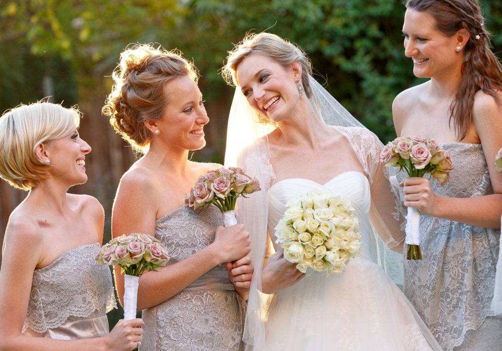 bride smiling with bridesmaids at Saint George's Anglican Church Parktown Johannesburg