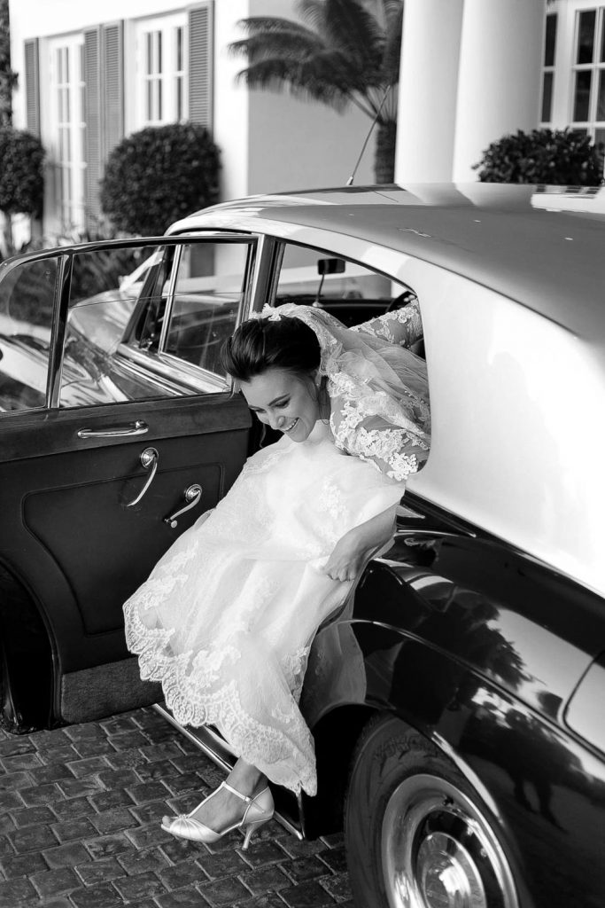 Bride getting out of the Rolls Royce wedding car at the Fourseasons Hotel The Westcliff Hotel Johannesburg