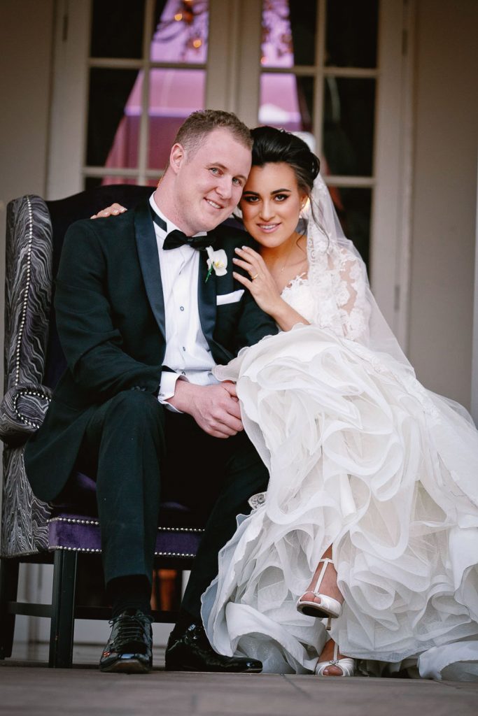 Bride and groom sitting down at the Fourseasons Hotel The Westcliff Hotel Johannesburg