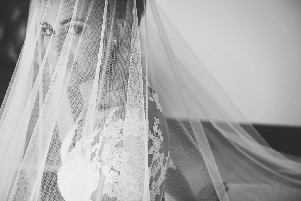 black and white image of the bride under the wedding veil the at Fourseasons Hotel The Westcliff Hotel Johannesburg