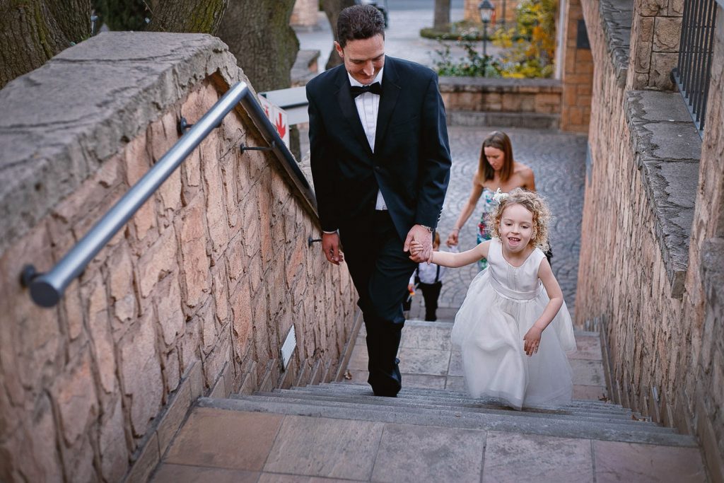 father and daughter walking up the stairs at Four Seasons Hotel The Westcliff