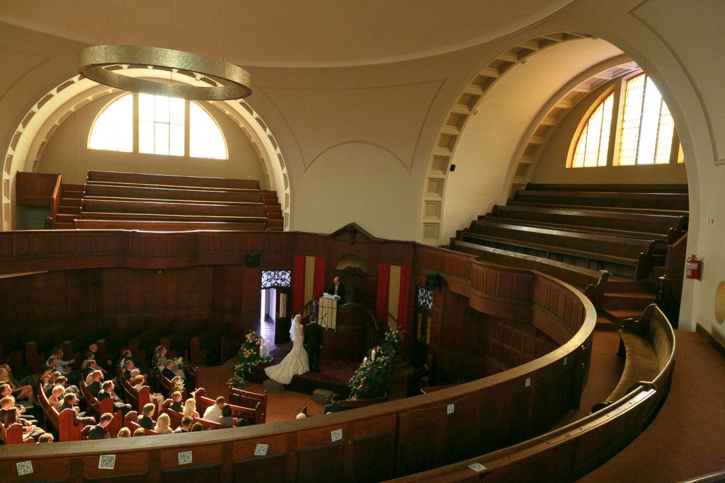 Wedding couple standing inside Die Ooskerk Kirkness Street Clydesdale Pretoria