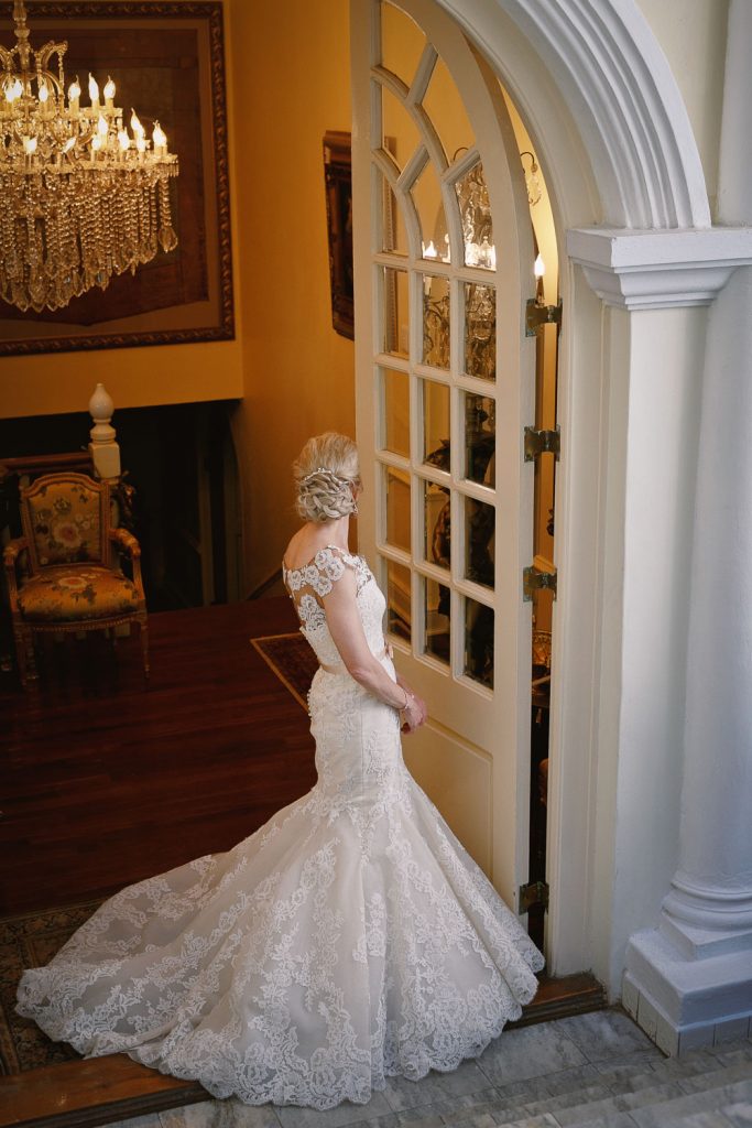 Bride standing at the front doors at Illyria House in Pretoria