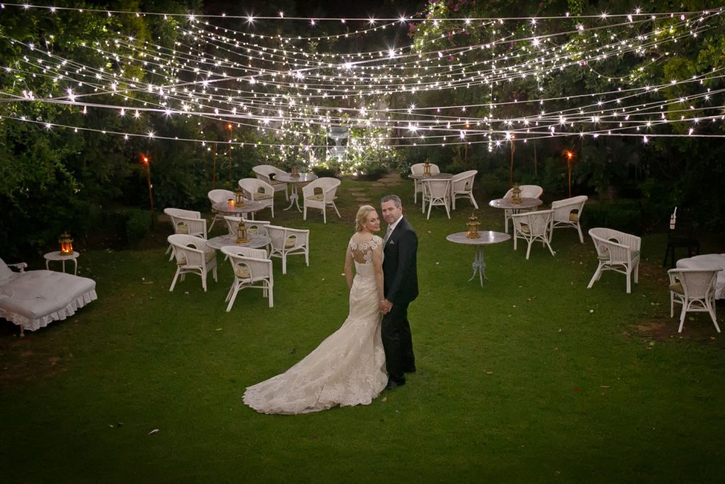 bridal couple under ferry lights at Illyria House in Pretoria