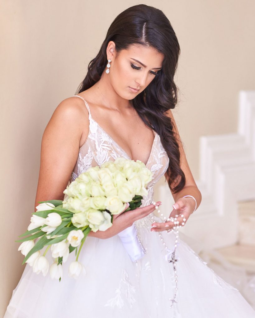 bride holding white wedding rose boutique at Le Chatelat Residence