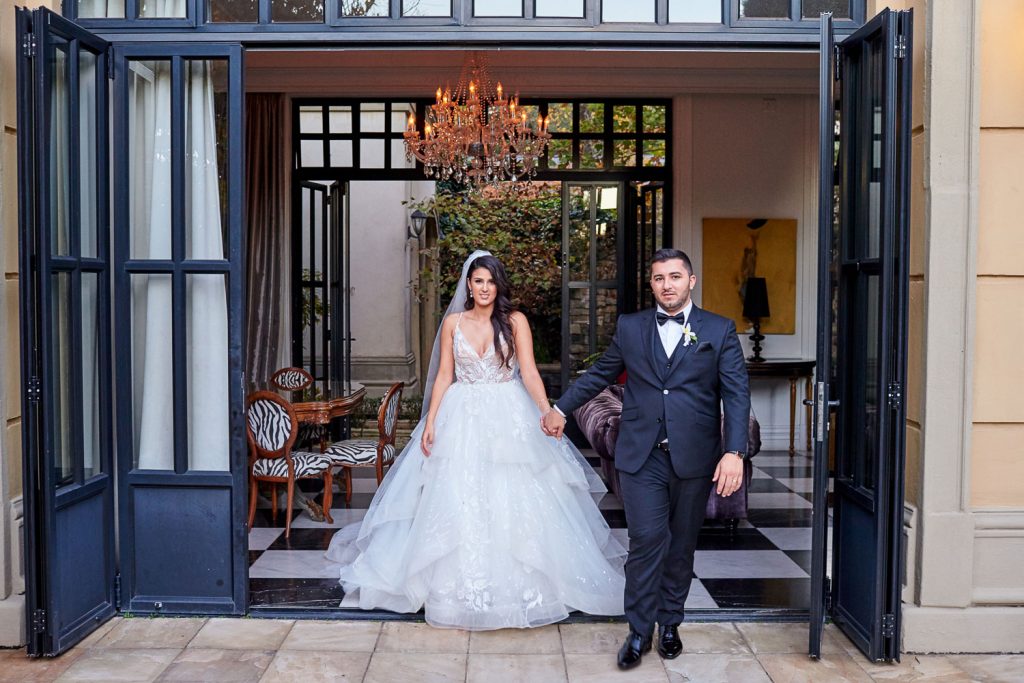 Bride and groom walking together at  Le Chatelat Residence