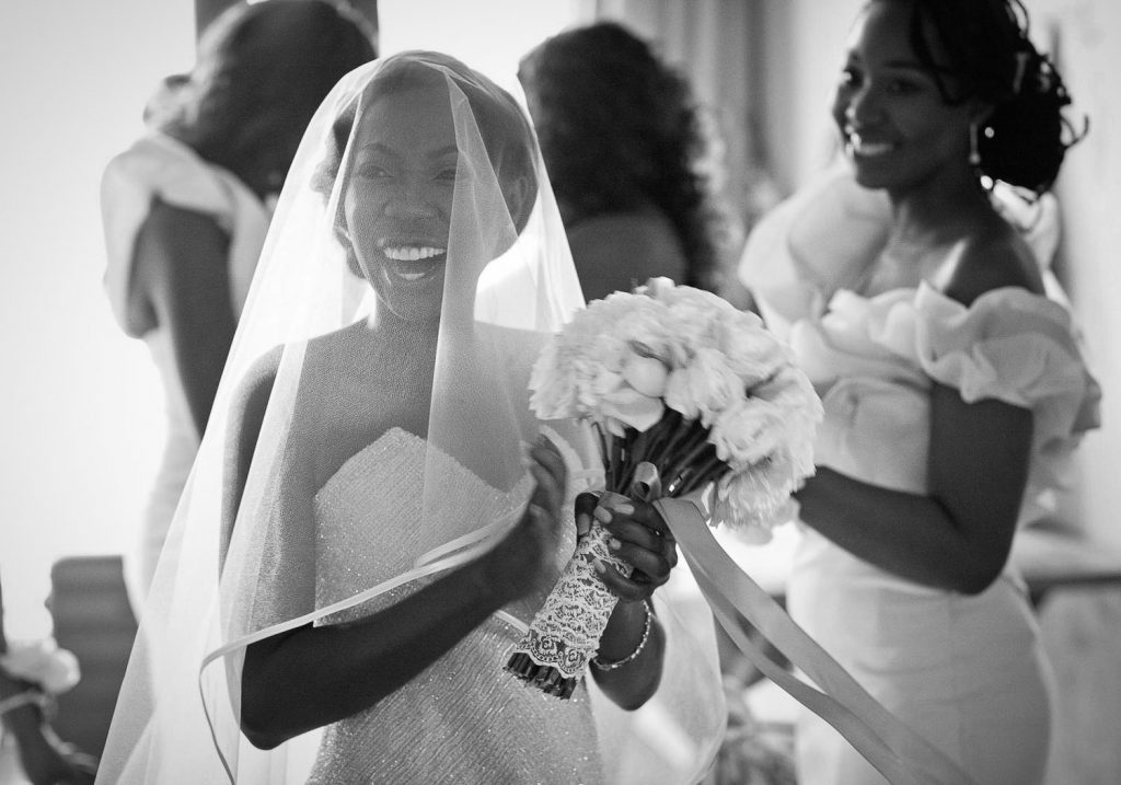 black and white image of the bride under her veil
