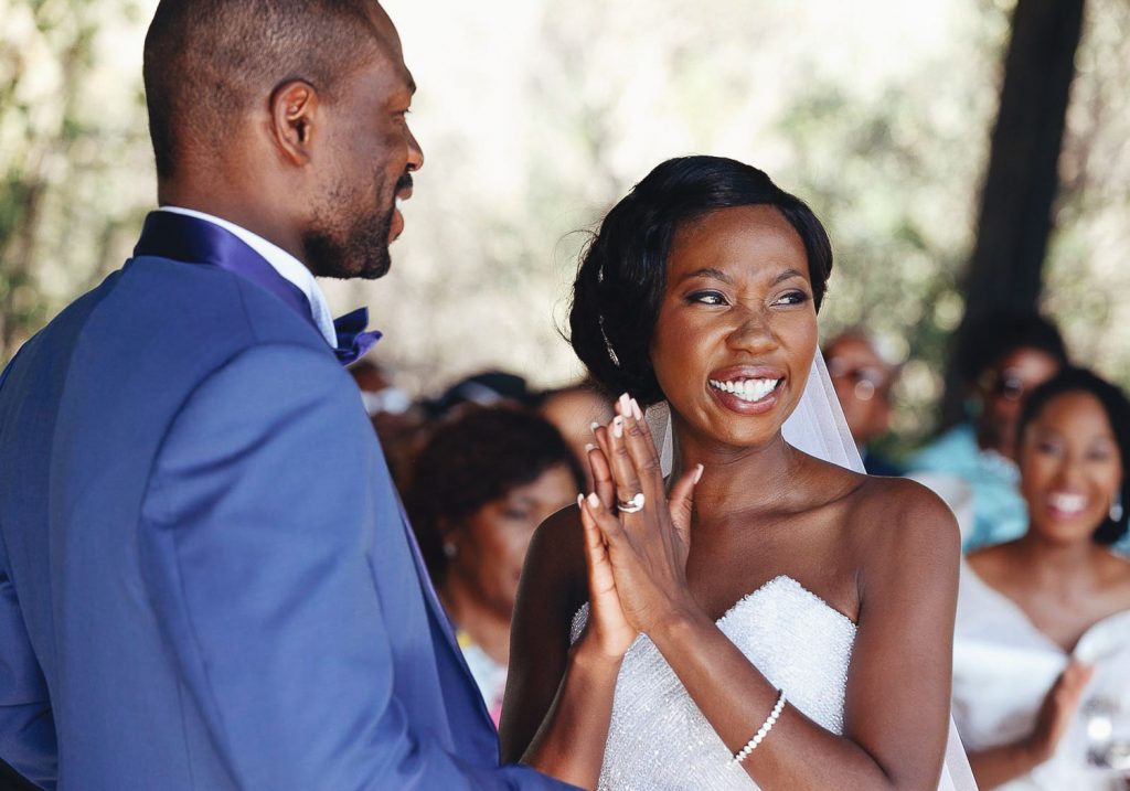bride clapping hands at Red Ivory Lodge