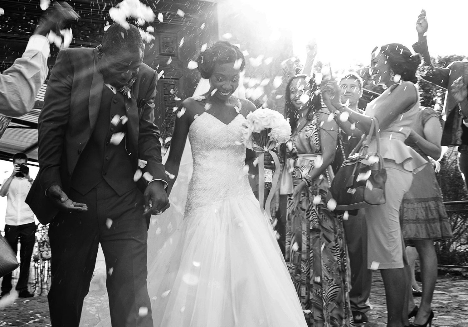 black and white image of bride and groom celebrating at Red Ivory Lodge