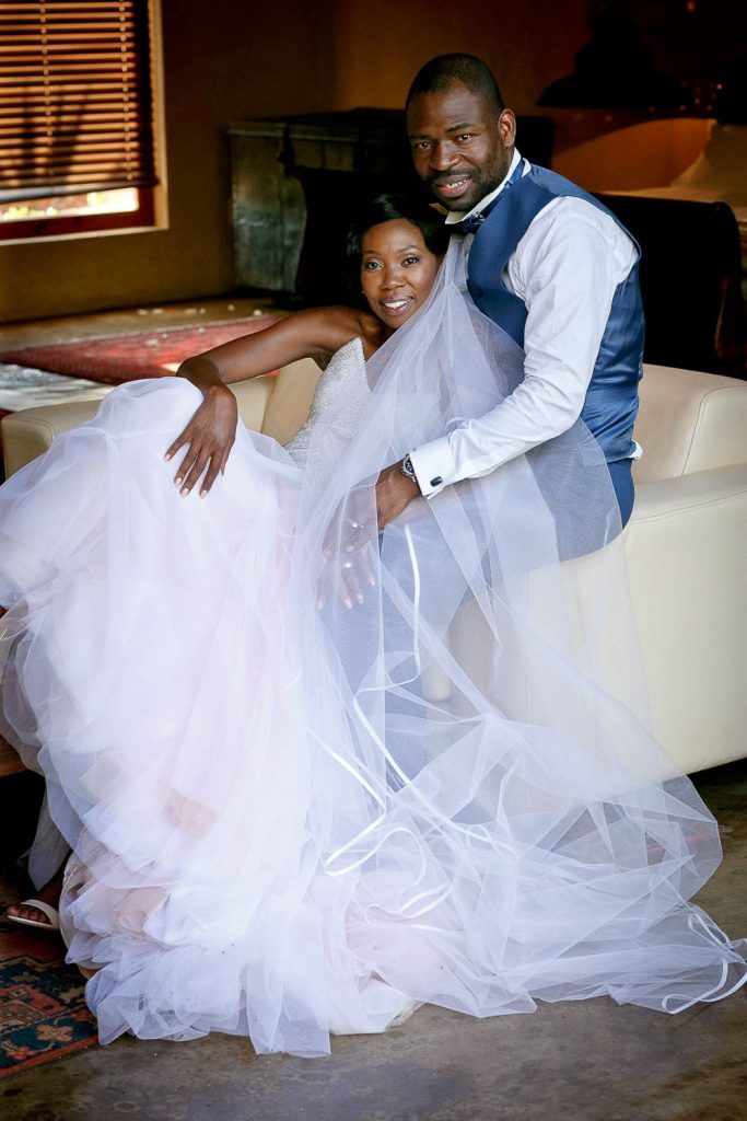 African wedding couple on the chair at Red Ivory Lodge