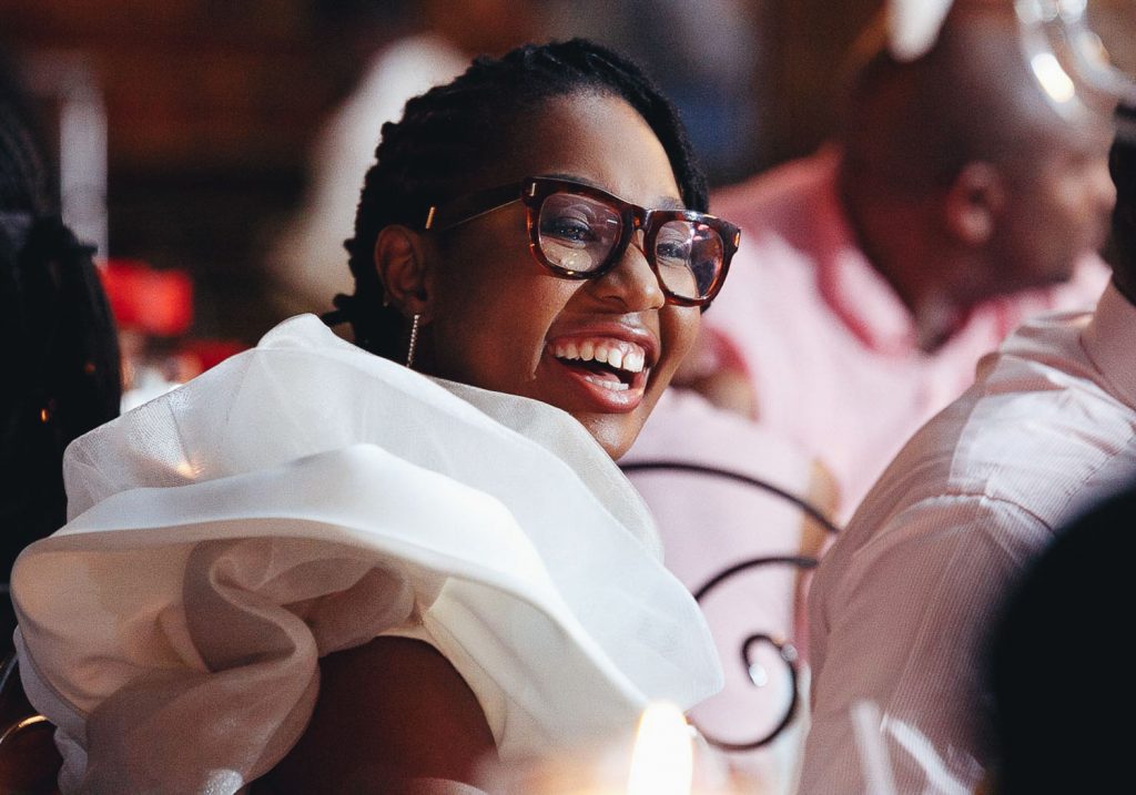 wedding guests laughing at Red Ivory Lodge