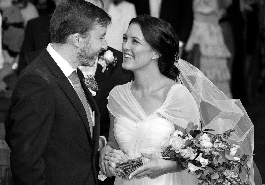 bride smiling at groom inside St. Columba's Presbyterian Church Parkview