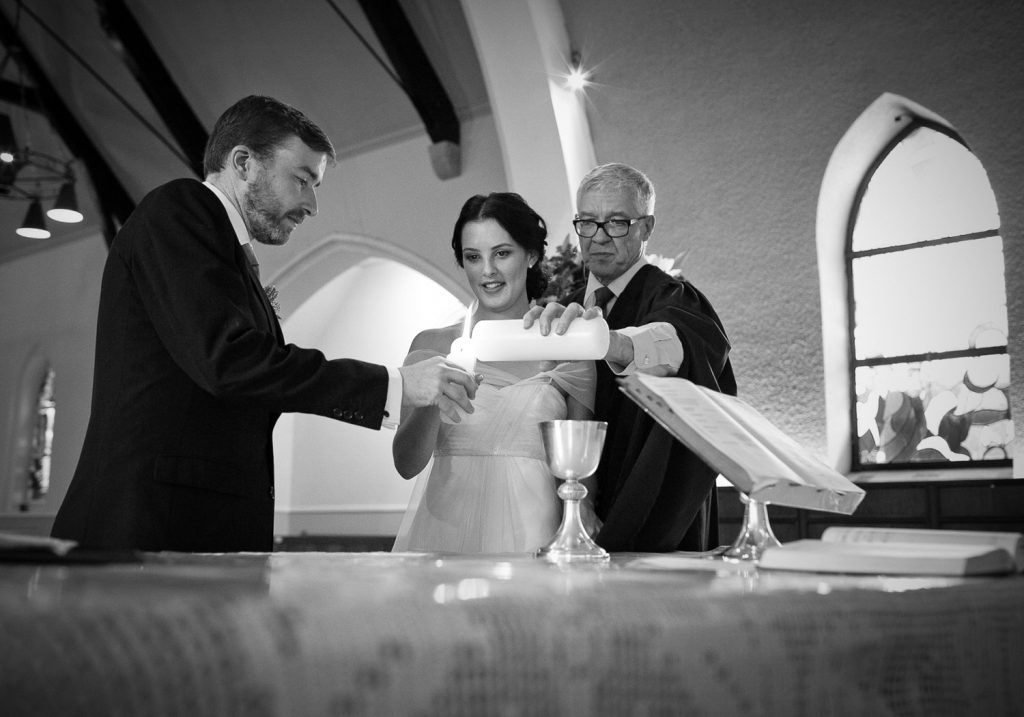 Wedding couple lighting the unity candles at Saint Columba's Presbyterian Church in Parkview