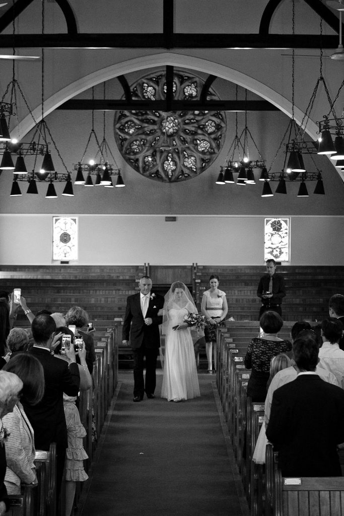 bride walking down the aisle at Saint Columba's Presbyterian Church in Parkview