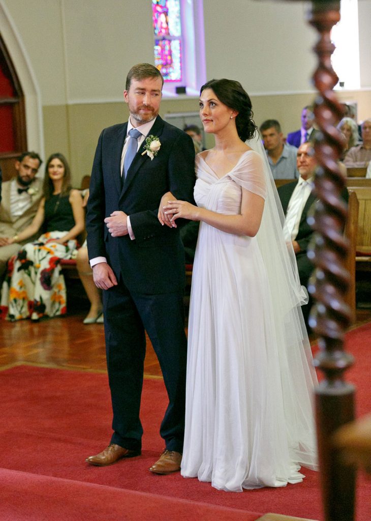groom looking at bride at Saint Columba's Presbyterian Church in Parkview