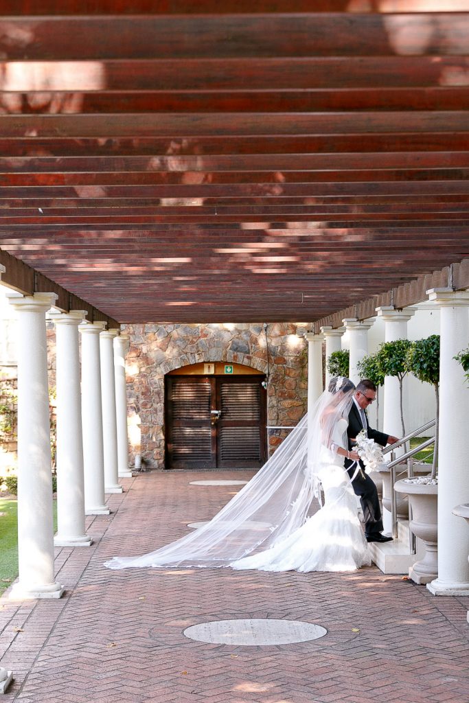Bride walking in the gardens at Summer Place Wedding Venue