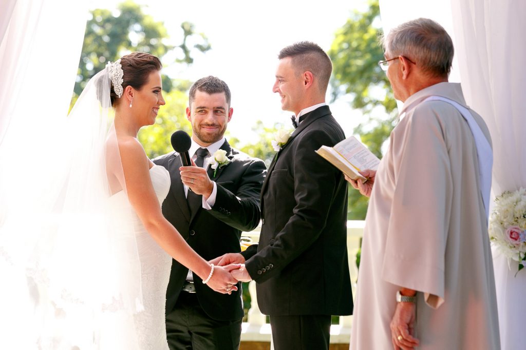 wedding couple standing under the trees at Summer Place Wedding Venue