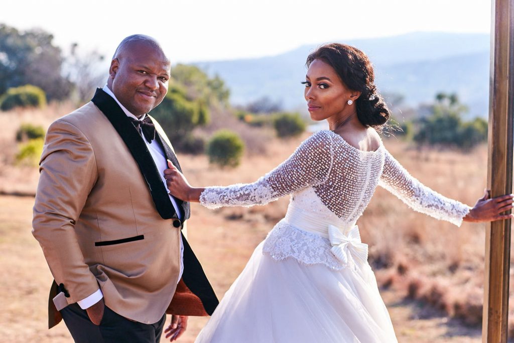 African wedding couple posing at Thaba ya Batswana wedding venue