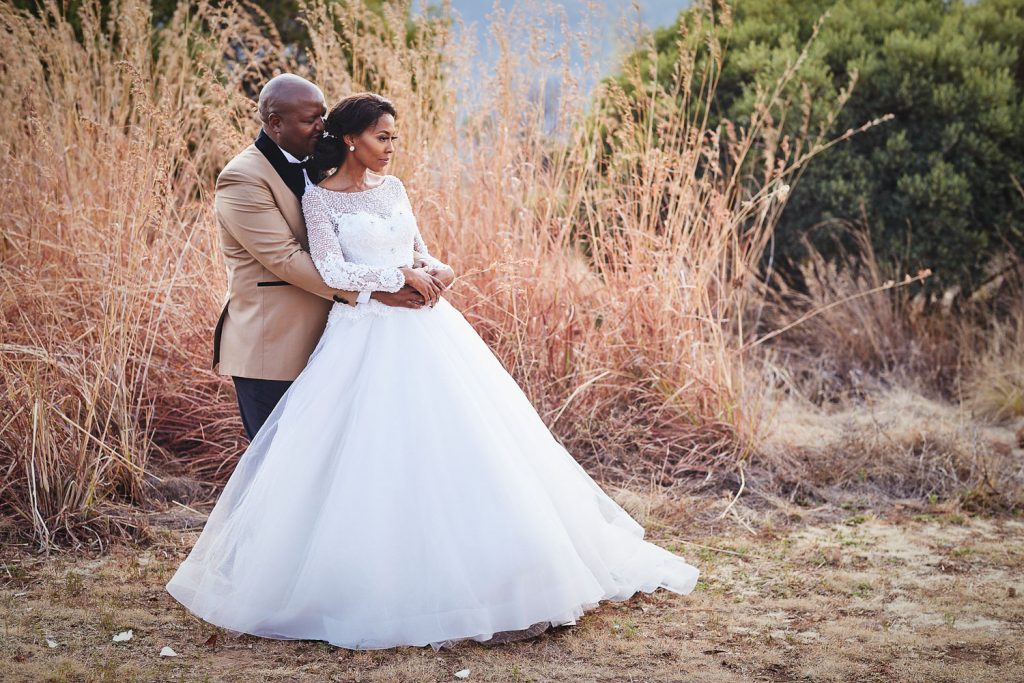 African wedding couple posing at Thaba ya Batswana wedding venue