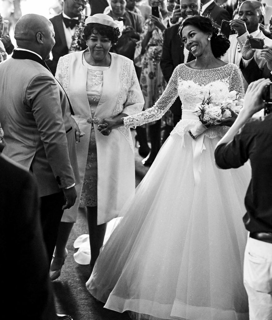 African wedding couple walking into the church at Thaba Eco Hotel wedding venue