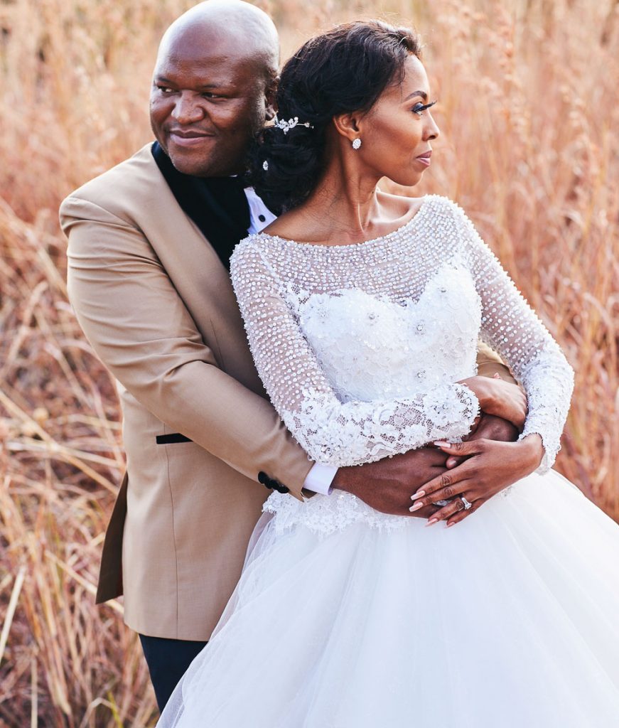 African couple hugging at Klipriviersberg Nature wedding venue