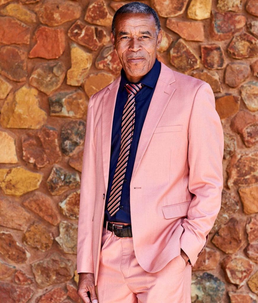 African man in a pink suit at Thaba Eco Hotel wedding venue