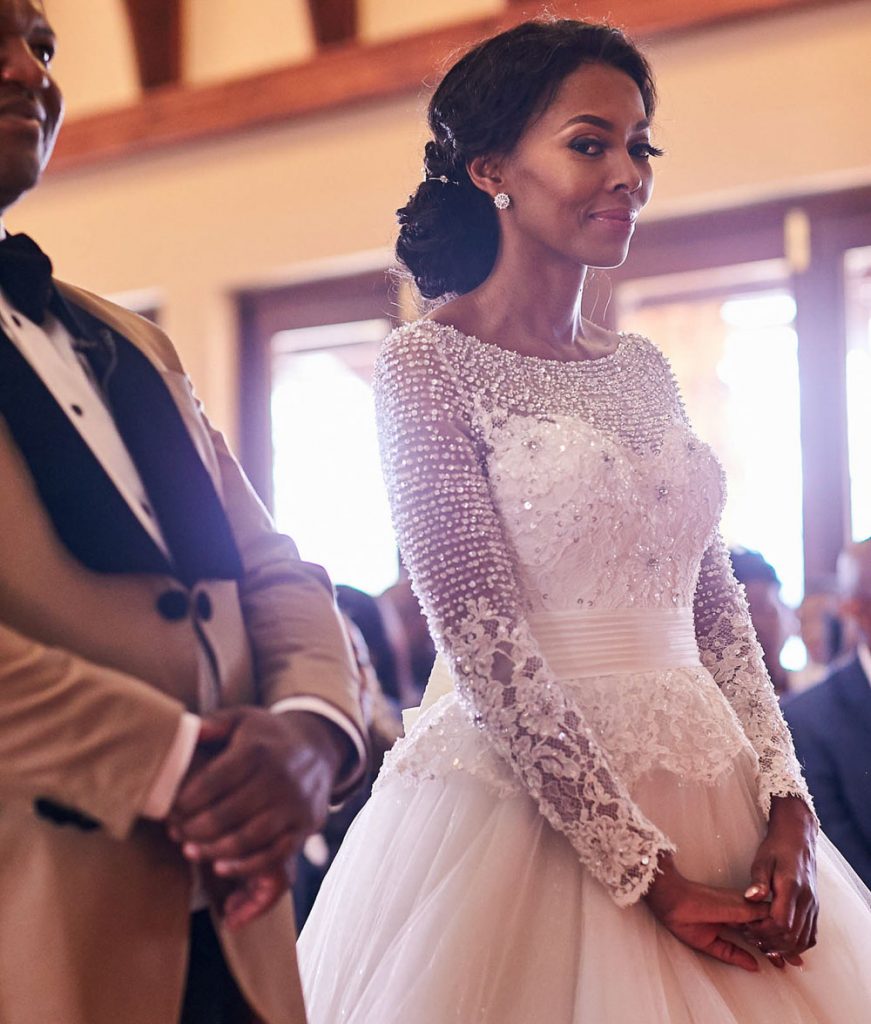Bride looking at the wedding photographer at Thaba Eco Hotel