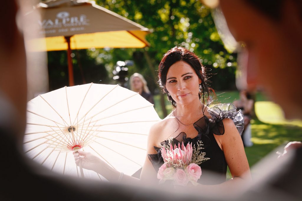 bridesmaid in black dress at Longmeadow Farm Fourways