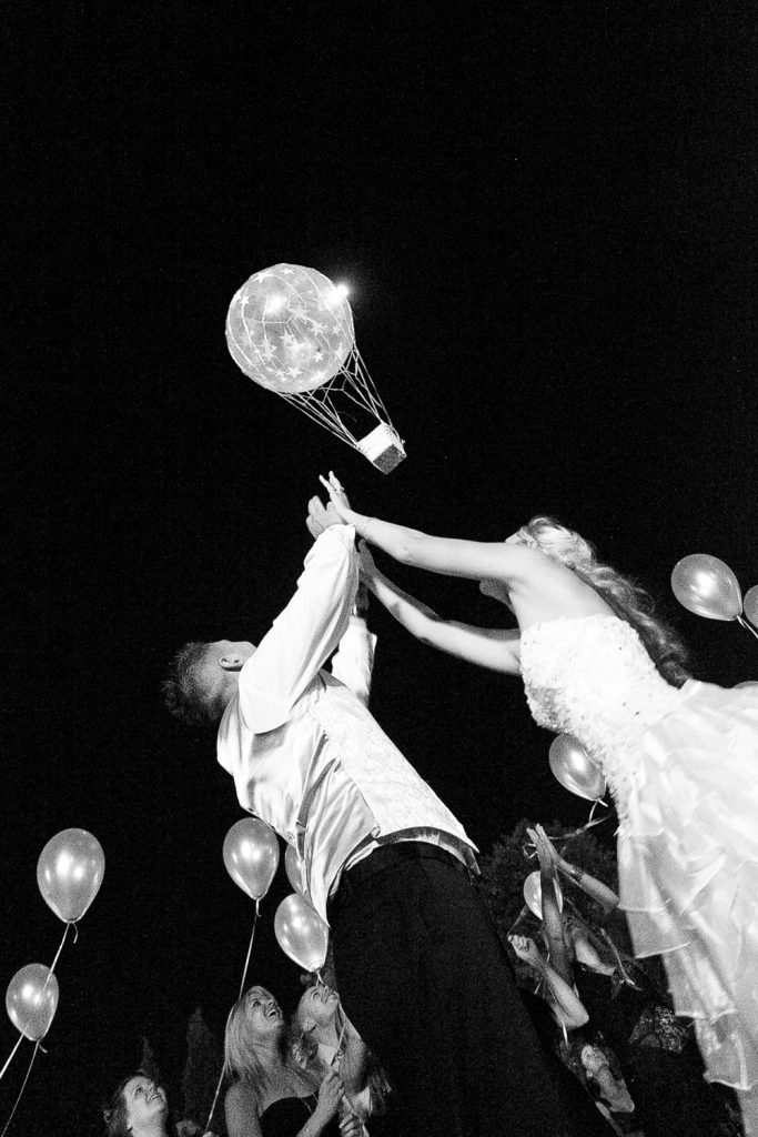 wedding couple watching balloons in the sky at Longmeadow Farm Fourways
