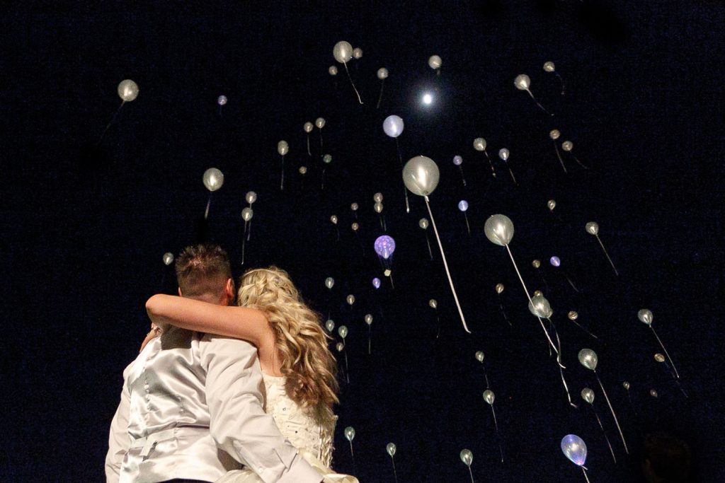 wedding couple watching balloons in the sky at Longmeadow Farm Fourways
