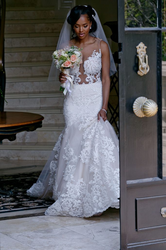 bride waling down the steps at wedding bouquet at Le Chatelat in Sandhurst