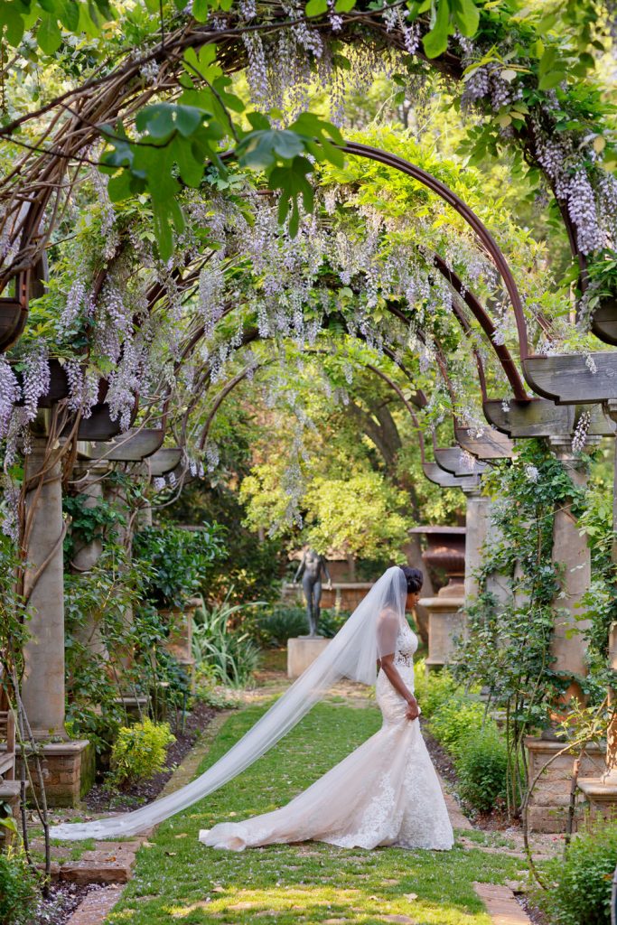 bride walking through the gardens at Beechwood Gardens in Hyde Park Sandton