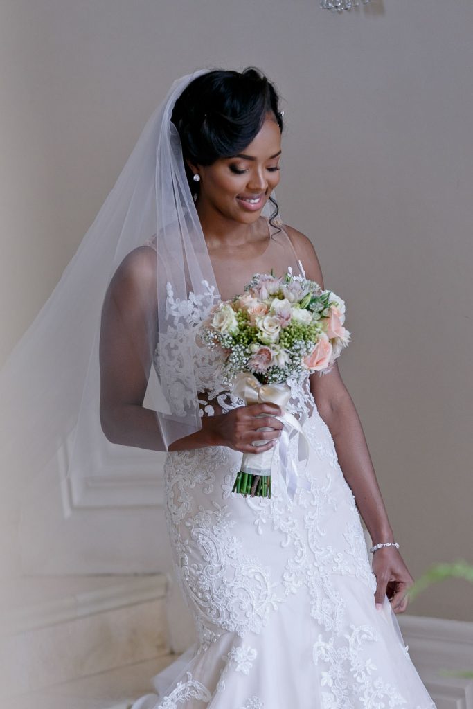 Bride with her wedding boutique leaving Le Chatelat in Sandhurst