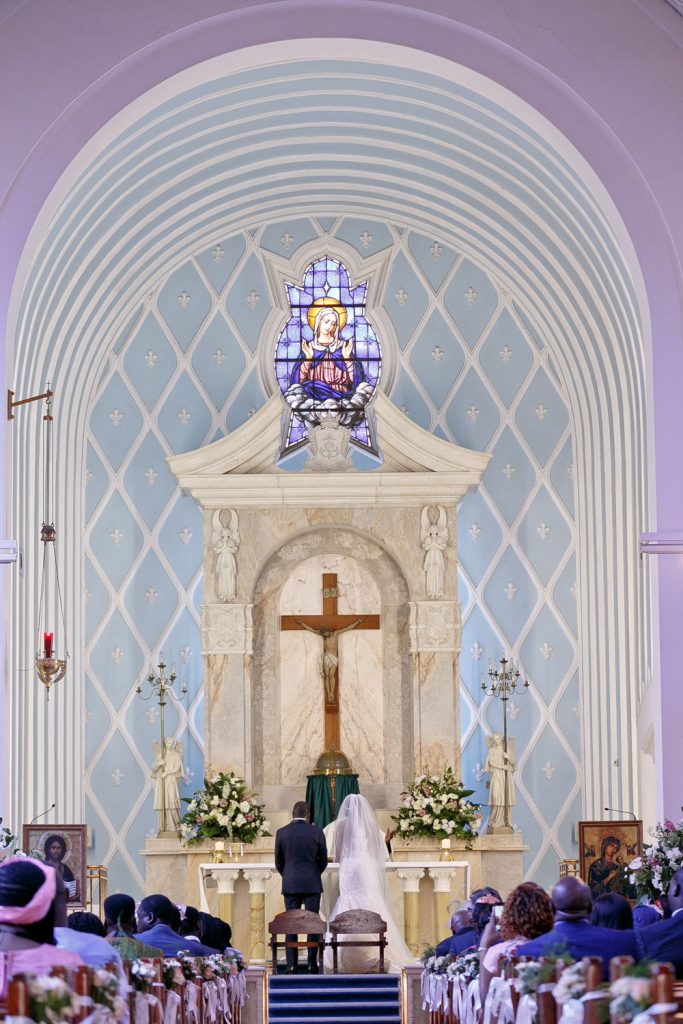 wedding couple standing at the alter inside the Rosebank Catholic Church in Keyes Avenue Johannesburg