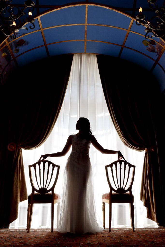 bride standing in front of the window at the Munro Boutique Hotel in Johannesburg