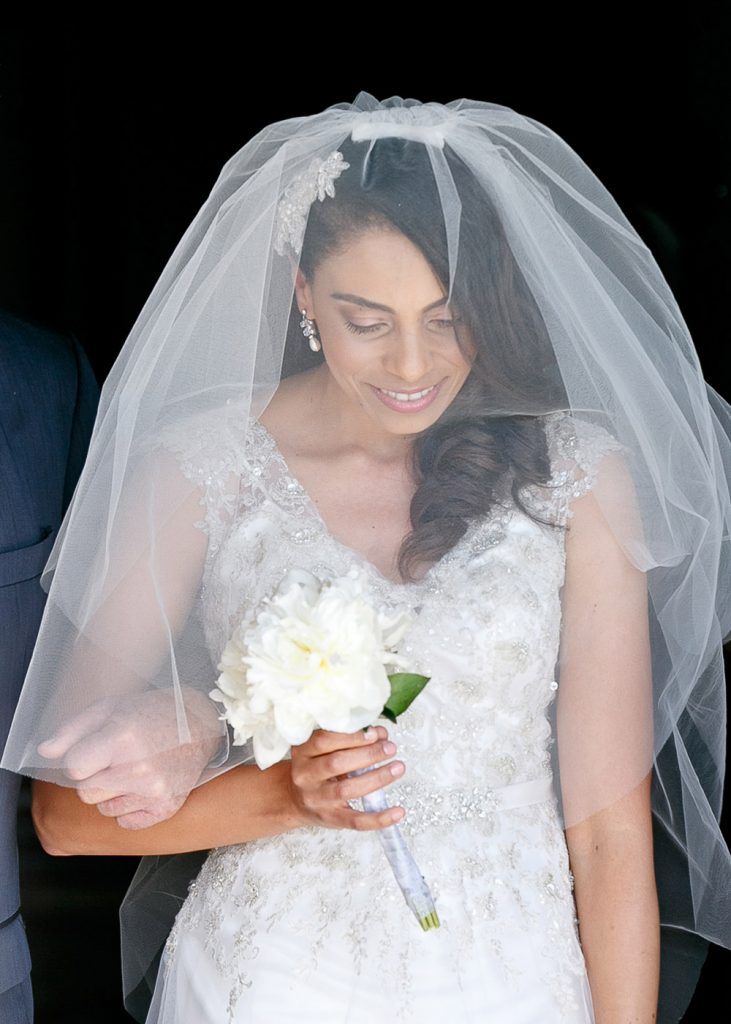 bride walking with her wedding bouquet at Munro Boutique Hotel in Johannesburg