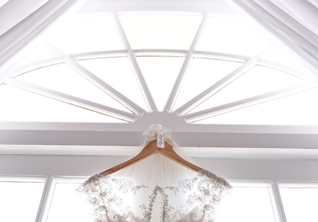 wedding dress hanging in front of the door at Munro Boutique Hotel in Johannesburg