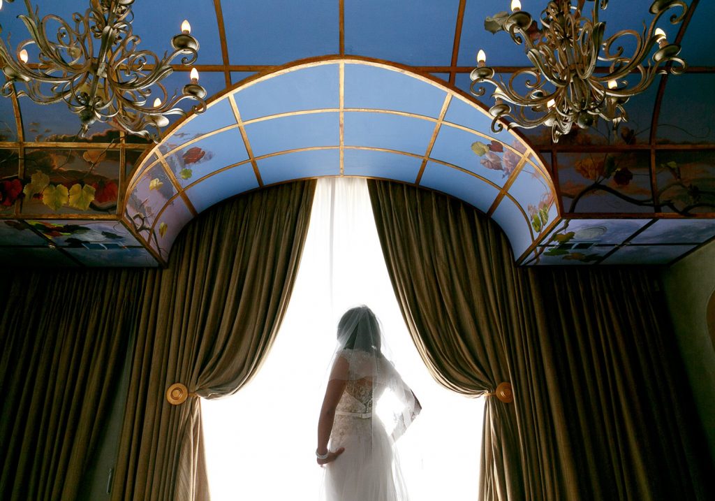 bride standing at the window Munro Boutique Hotel in Johannesburg