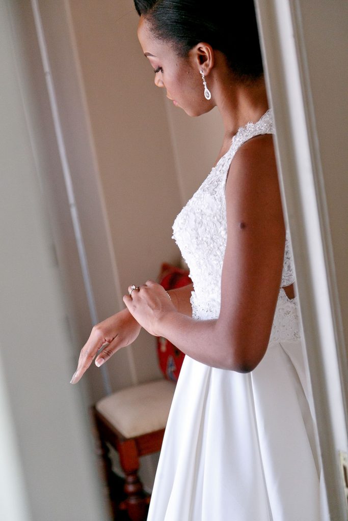 African bride getting dressed at The Grand Palm Hotel in Gabarone Botswana