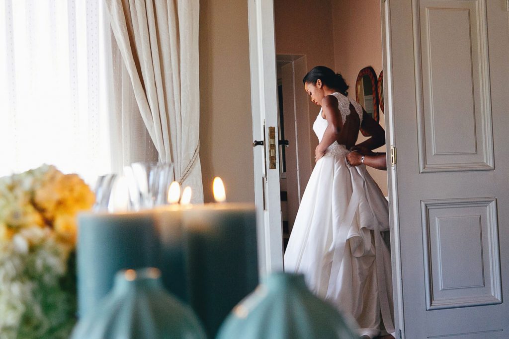 African bride getting dressed in Botswana