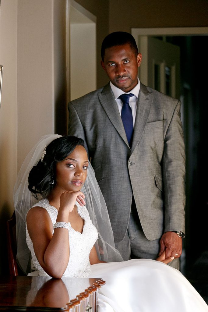 African bride sitting in a chair at the Grand Palm Hotel Gabarone