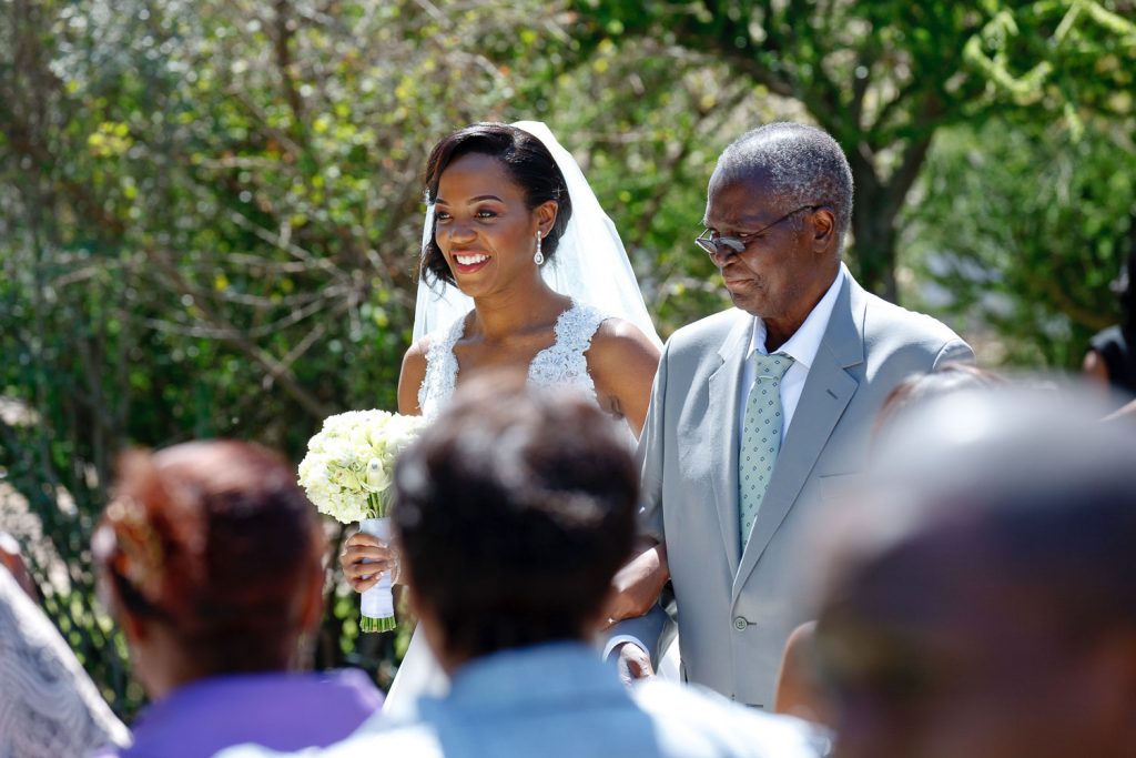 father walking the bride down the aisle at the Grand Palm Hotel Gabarone