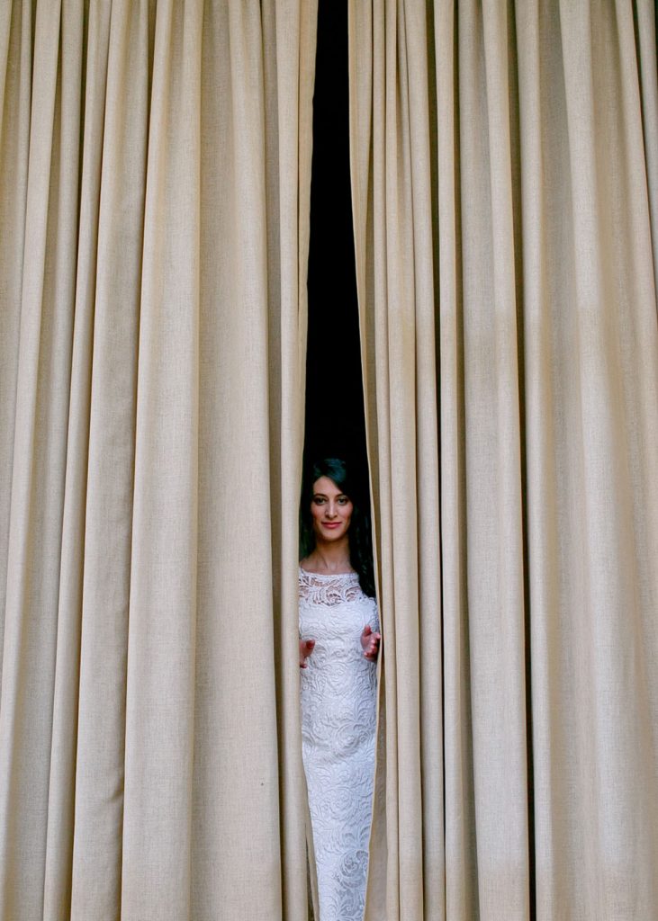 Jewish bride peeping through the curtain Weddings at Forum Homini
