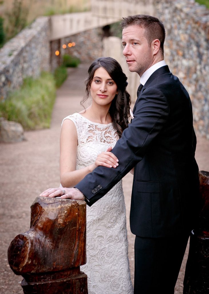 Jewish bride holding the grooms arm