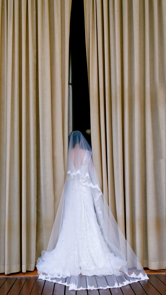 Jewish bride walking behind the curtains