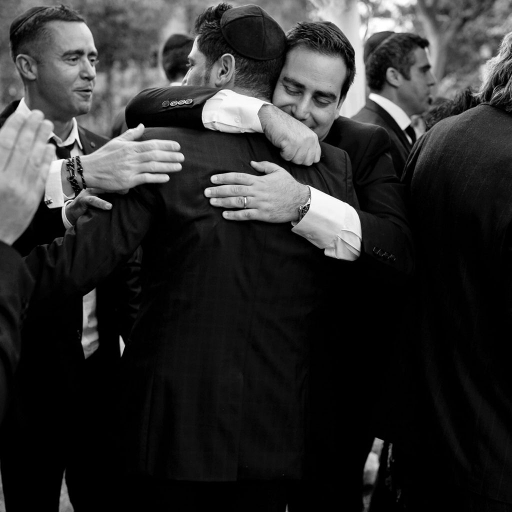 Jewish men hugging at The Palazzo Hotel