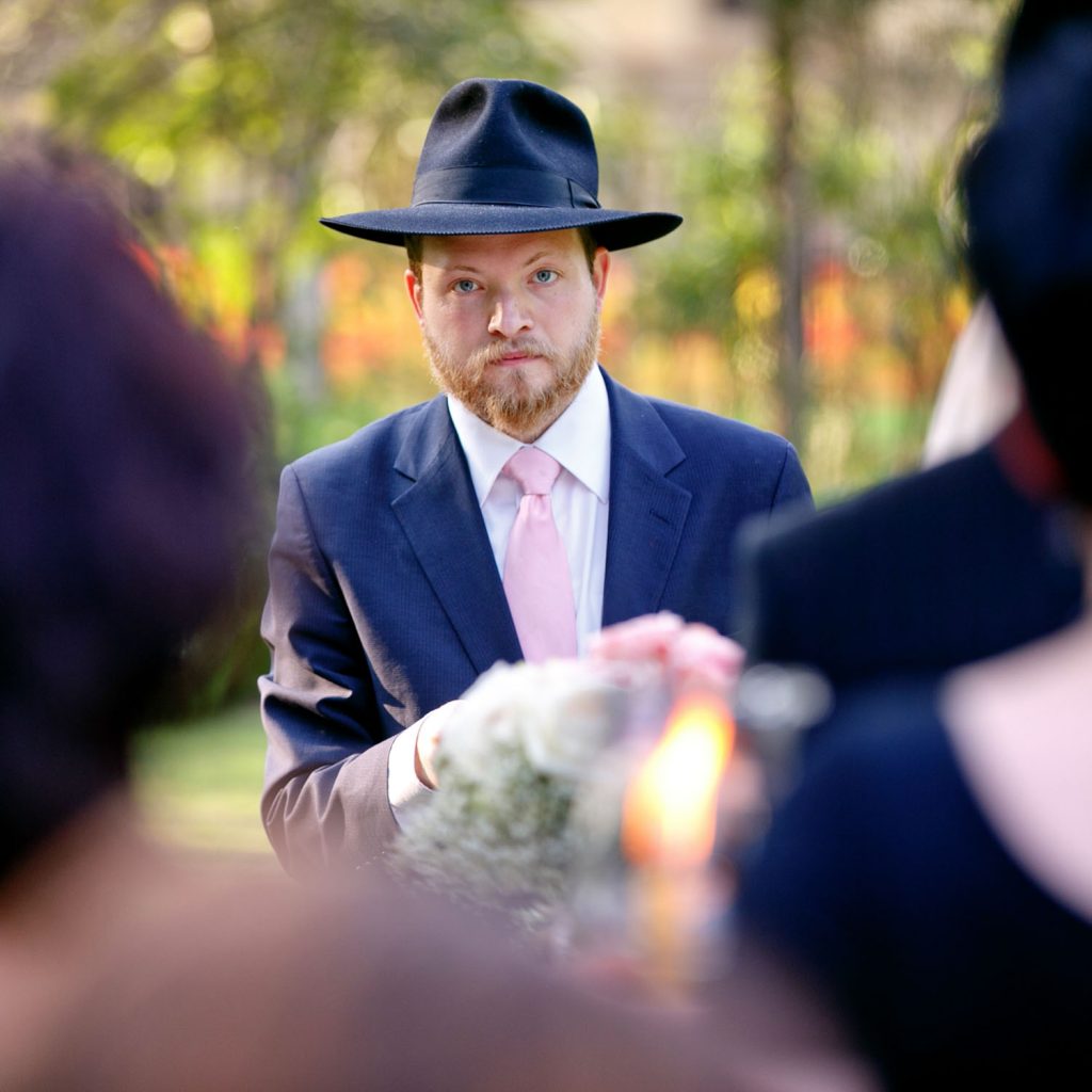 Jewish Rabbi looking at the Jewish wedding photographer